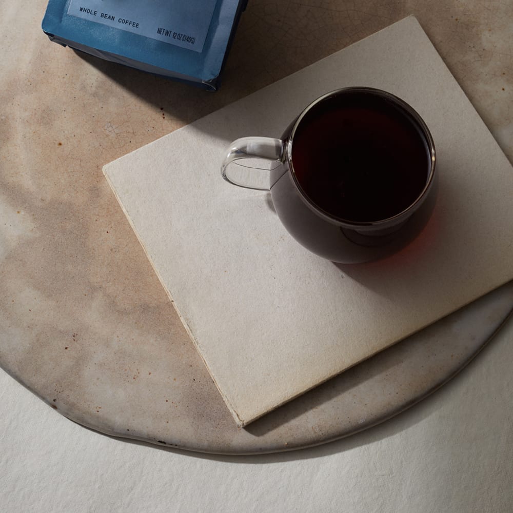 three africas coffee in a glass mug