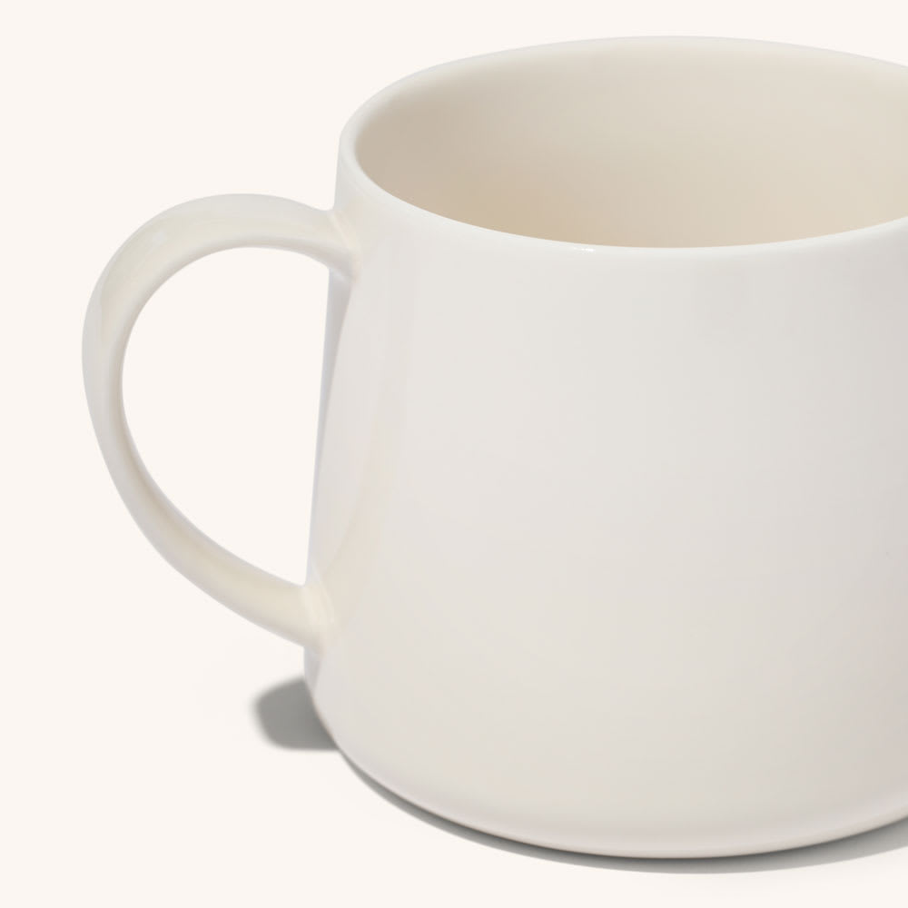 Detail view of the handle of the blue bottle mug.